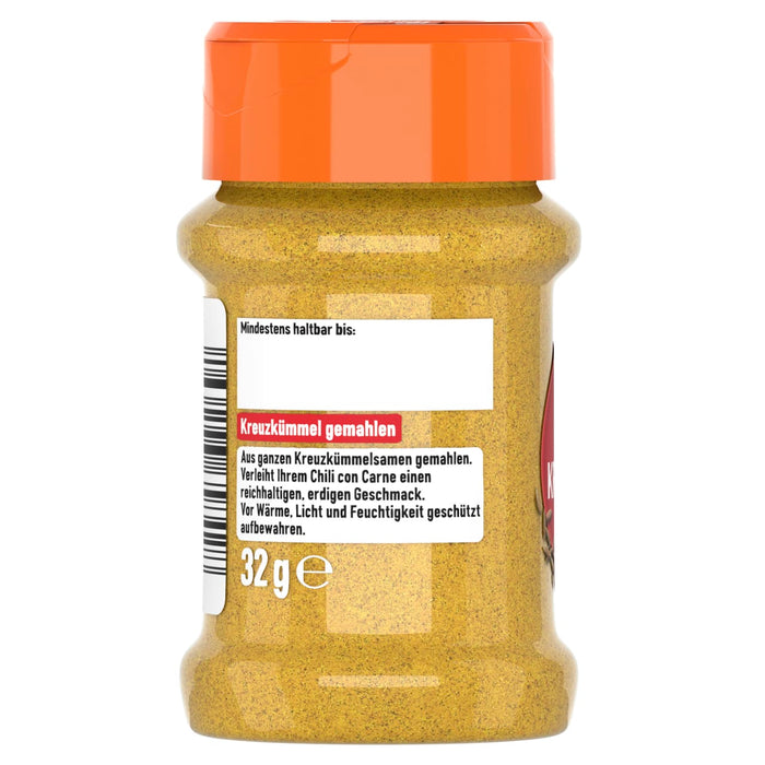 Die Rückseite eines durchsichtigen Gewürzglases mit orangefarbenem Deckel, das das deutsche Etikett für Kreuzkümmel gemahlen zeigt.
