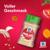 Eine Flasche Srpet Garlic Granul X06-Ge von McCormick ist von schwebenden Zutaten wie Knoblauchzehen und Pfefferkörnern vor einem leuchtend roten Hintergrund mit dem Text Voller Geschmack umgeben.