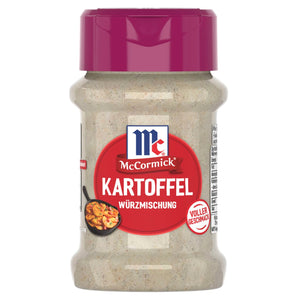 Eine durchsichtige Flasche McCormick Kartoffel Würzmischung, eine deutsche Gewürzmischung für Kartoffeln, wird mit ihrem charakteristischen roten Etikett und der magentafarbenen Kappe gezeigt.