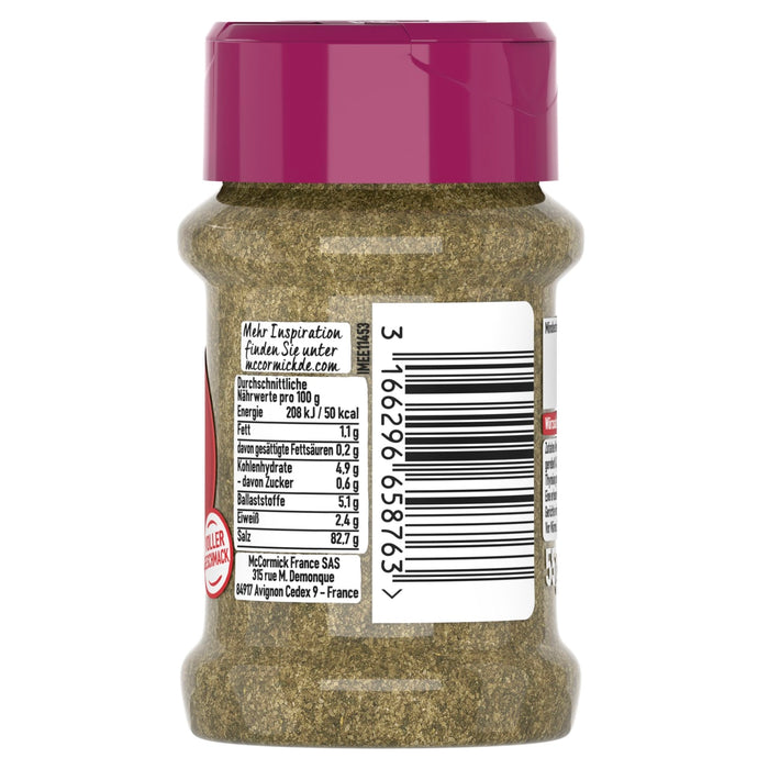 Die Rückseite eines durchsichtigen McCormick-Gewürzglases mit magentafarbenem Deckel, die die Nährwertangaben und Herstellerdetails für ein grünes Kräutergewürz zeigt.